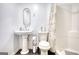 Clean bathroom featuring a pedestal sink, toilet, and bathtub with a shower at 4180 Mount Paran Dr, Social Circle, GA 30025