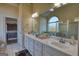 Spacious bathroom featuring double sinks, ample counter space, and a large mirror at 4180 Mount Paran Dr, Social Circle, GA 30025