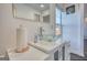 Stylish bathroom featuring a modern glass bowl sink, white vanity, elegant faucet, and bright natural light at 4180 Mount Paran Dr, Social Circle, GA 30025