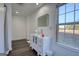 Bathroom with a modern vanity featuring a glass bowl sink, mirror and a view from the window at 4180 Mount Paran Dr, Social Circle, GA 30025