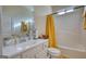 Bathroom featuring a vanity, mirror, toilet and bathtub with shower at 4180 Mount Paran Dr, Social Circle, GA 30025