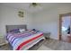 Bedroom with ceiling fan and bed with patterned bedding at 4180 Mount Paran Dr, Social Circle, GA 30025