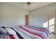 Bedroom with ceiling fan and bed with patterned bedding at 4180 Mount Paran Dr, Social Circle, GA 30025