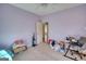 Spacious bedroom with ceiling fan and door leading to the hall at 4180 Mount Paran Dr, Social Circle, GA 30025