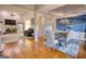 Open-concept dining room with hardwood floors, modern chandelier, and natural light at 4180 Mount Paran Dr, Social Circle, GA 30025