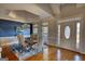 Bright dining room with hardwood floors, modern chandelier, chair-rail, and natural light at 4180 Mount Paran Dr, Social Circle, GA 30025