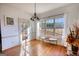 Inviting dining room with natural light, hardwood floors, and stylish chandelier at 4180 Mount Paran Dr, Social Circle, GA 30025