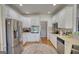 Stylish kitchen with stainless steel appliances and all white cabinetry at 4180 Mount Paran Dr, Social Circle, GA 30025