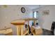 Bright landing space with laminate floors, double doors, and natural light streaming through a window with blue curtains at 4180 Mount Paran Dr, Social Circle, GA 30025