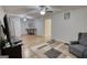 Spacious living room featuring wood floors, ample seating, and natural light, ideal for entertaining and relaxation at 4180 Mount Paran Dr, Social Circle, GA 30025