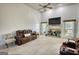 Spacious living room boasts a fireplace, large windows, and comfortable seating at 4180 Mount Paran Dr, Social Circle, GA 30025
