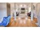Spacious living room with vaulted ceiling, fireplace, plush seating, and natural light at 4180 Mount Paran Dr, Social Circle, GA 30025