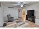 Relaxing living area features wood-look floors, TV, and a comfortable chair, providing a welcoming and cozy space at 4180 Mount Paran Dr, Social Circle, GA 30025
