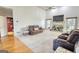 Living room with vaulted ceiling, brick fireplace, and plush seating at 4180 Mount Paran Dr, Social Circle, GA 30025