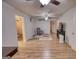 Comfortable living area with wood-look flooring, a ceiling fan, and stylish furnishings, providing a welcoming space at 4180 Mount Paran Dr, Social Circle, GA 30025