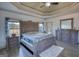 A nicely decorated main bedroom features light and bright decor and hardwood floors at 4180 Mount Paran Dr, Social Circle, GA 30025