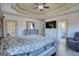 Cozy and spacious main bedroom featuring neutral colors, a ceiling fan, and hardwood floors at 4180 Mount Paran Dr, Social Circle, GA 30025