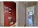 Hallway leading to the powder room that has unique decor and an open view of the main bedroom at 4180 Mount Paran Dr, Social Circle, GA 30025