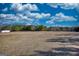 Expansive property with a large, open field and a line of trees in the background, perfect for recreation and privacy at 4180 Mount Paran Dr, Social Circle, GA 30025
