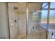Tiled shower with rain shower head and glass enclosure featuring a built in bench at 4180 Mount Paran Dr, Social Circle, GA 30025