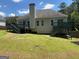 View of the backyard with two decks and stairs leading to the yard at 2828 Hicks Sw Rd, Marietta, GA 30060