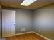 Finished basement area with neutral walls and laminate flooring at 2828 Hicks Sw Rd, Marietta, GA 30060