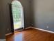 Bedroom featuring hardwood floors and window bringing in natural light with views at 2828 Hicks Sw Rd, Marietta, GA 30060