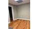 An empty bedroom boasts hardwood floors, neutral walls, closet, and simple design at 2828 Hicks Sw Rd, Marietta, GA 30060