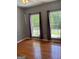 Bedroom featuring hardwood floors and large windows bringing in natural light with outside views at 2828 Hicks Sw Rd, Marietta, GA 30060