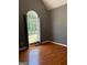 Bedroom featuring hardwood floors and a large window bringing in natural light and views at 2828 Hicks Sw Rd, Marietta, GA 30060