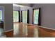 Inviting bonus room with hardwood floors, natural light, and neutral paint colors at 2828 Hicks Sw Rd, Marietta, GA 30060