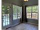 Cozy breakfast nook offering backyard views, deck access, and tile flooring at 2828 Hicks Sw Rd, Marietta, GA 30060