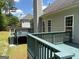 Elevated wooden deck with blue-green finish and railing offers a backyard view and outdoor living space at 2828 Hicks Sw Rd, Marietta, GA 30060