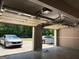 Attached two car garage with automatic door opener, offering ample parking with drive-through access at 2828 Hicks Sw Rd, Marietta, GA 30060