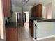 A kitchen with tiled floors and standard appliances connects seamlessly to other areas of the home at 2828 Hicks Sw Rd, Marietta, GA 30060