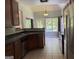 Bright kitchen featuring stainless steel appliances, breakfast area, and backyard views at 2828 Hicks Sw Rd, Marietta, GA 30060