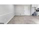 Finished basement area with gray walls, white trim, and easy access to the kitchen at 106 June Ct, Hampton, GA 30228