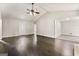 Spacious living room with hardwood floors, vaulted ceiling, and a front door with a decorative glass insert at 106 June Ct, Hampton, GA 30228