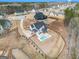 Expansive aerial view of a modern home with a private pool and large yard in a quiet, wooded neighborhood at 260 Cicely Way, Tyrone, GA 30290