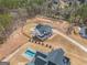 Drone shot of a modern home with a large backyard, private pool and natural surroundings at 260 Cicely Way, Tyrone, GA 30290