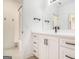 Modern bathroom features white cabinetry, quartz countertop, and combination tub and shower at 260 Cicely Way, Tyrone, GA 30290