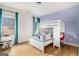 Playful bedroom features a bunk bed with desk and nearby window with natural light at 260 Cicely Way, Tyrone, GA 30290