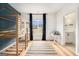 Spacious bedroom with a unique bunk bed, hardwood floors, and natural light at 260 Cicely Way, Tyrone, GA 30290