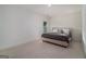 Neutral bedroom with a large bed, soft carpet, and natural light from a window at 260 Cicely Way, Tyrone, GA 30290