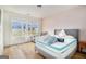 Bright bedroom with hardwood floors and multiple windows for natural light at 260 Cicely Way, Tyrone, GA 30290