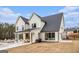Back exterior of a modern farmhouse with a covered patio, inground pool, and spacious yard at 260 Cicely Way, Tyrone, GA 30290