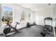 Home gym with various equipment, including a stationary bike, treadmill, and weights at 260 Cicely Way, Tyrone, GA 30290