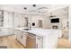 Modern kitchen with white cabinets, large island, stainless steel appliances and seamless design at 260 Cicely Way, Tyrone, GA 30290