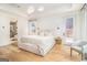 Bright, inviting main bedroom with wood floors and access to a private balcony at 260 Cicely Way, Tyrone, GA 30290