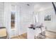 Bright office space with shiplap walls, modern desk, and natural light from large windows at 260 Cicely Way, Tyrone, GA 30290
